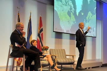 Norwegian Prime Minister Jonas Gahr Støre, pointing to a map, joined U.S. Sen. Amy Klobuchar, D-Minn., and moderator Tom Hanson at an event at Norway