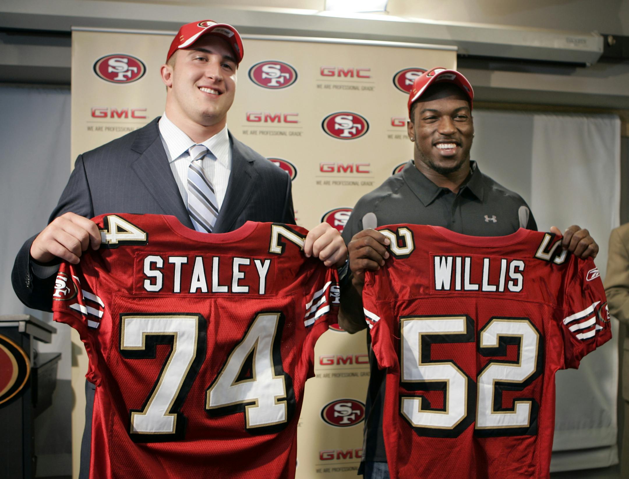 San Francisco 49ers first round NFL football draft picks Patrick Willis, right, linebacker with Mississippi, and Joe Staley, left, offensive tackle with Central Michigan, smile with their new jerseys during a news conference at 49ers headquarters in Santa Clara, Calif., Sunday, April 29, 2007. (AP Photo/Paul Sakuma) ORG XMIT: CAPS110