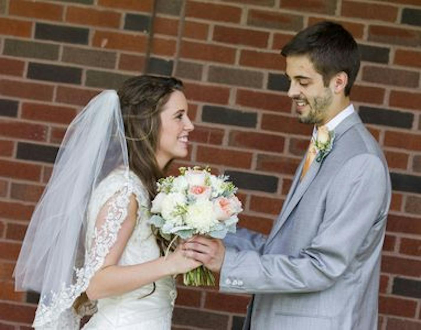 Jill Dillard, formerly Duggar, and Derick Dillard share a private moment after seeing each other for the first time prior to their wedding on June 21, 2014 in Springdale, Arkansas. (Discovery Communications).