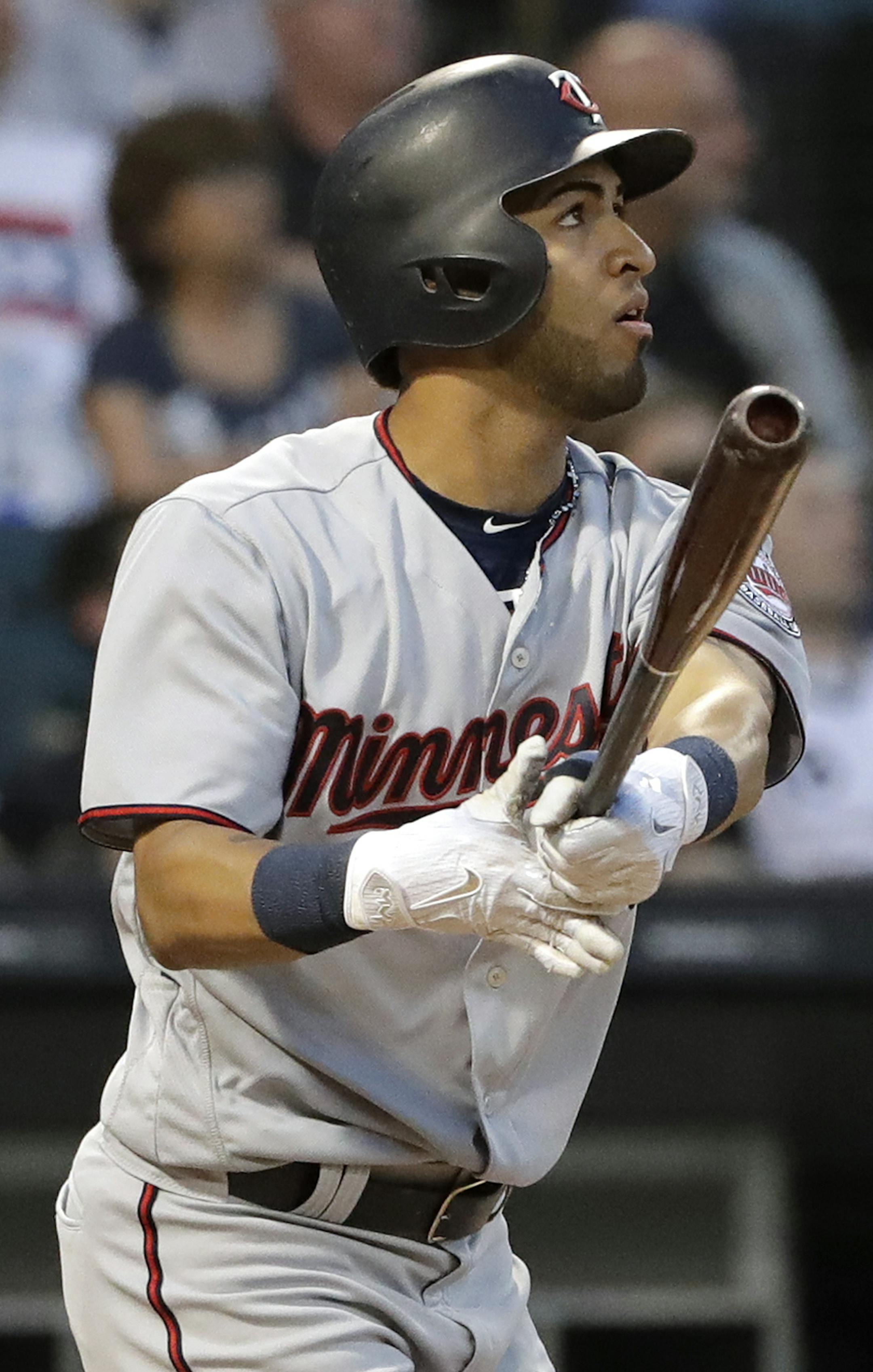 Minnesota Twins' Eddie Rosario watches his two-run double during the fourth inning of a baseball game against the Chicago White Sox, Saturday, May 5, 2018, in Chicago. (AP Photo/Nam Y. Huh)