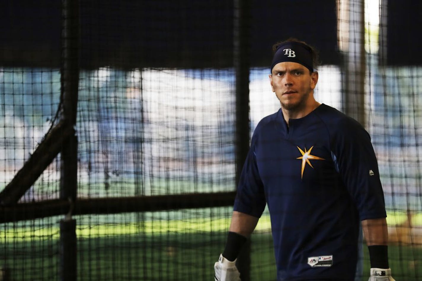 Tampa Bay Rays' Logan Morrison walks into the batting cage to hit during a spring training baseball workout in Port Charlotte, Fla., Wednesday, Feb. 22, 2017.