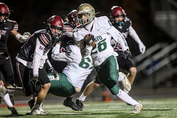 Rochester Mayo running back Isaiah Beale (26) turned the corner and headed for the end zone for one of his two second-half touchdowns in a 42-14 victo