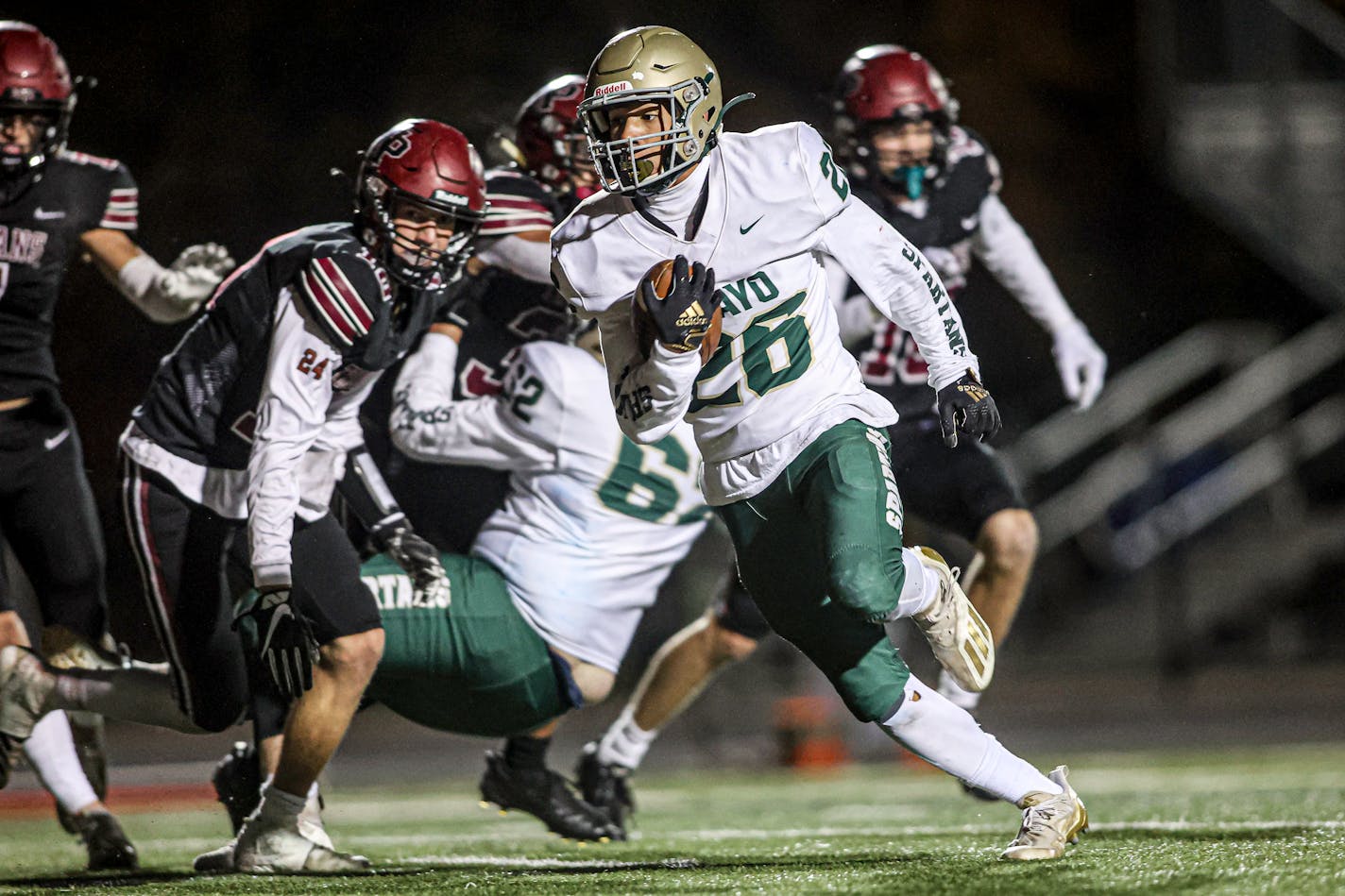 Rochester Mayo running back Isaiah Beale (26) turned the corner and headed for the end zone for one of his two second-half touchdowns in a 42-14 victory at New Prague. Photo by Mark Hvidsten, SportsEngine