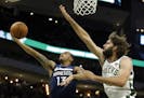 Wolves guard Shabazz Napier shot against the Bucks' Robin Lopez during the second half of a preseason NBA game Thursday.