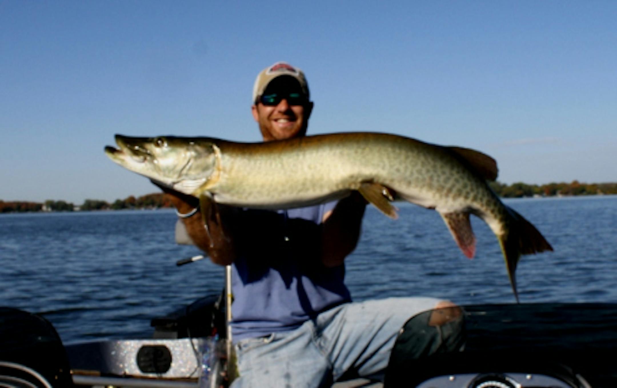 Travis Frank hoists a 50 inch muskie caught during the 2010 season.