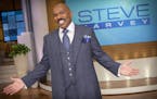 In this August 2012 photo provided by NBC, host Steve Harvey stands on the set of his new talk show "The Steve Harvey Show," in Chicago. The veteran c
