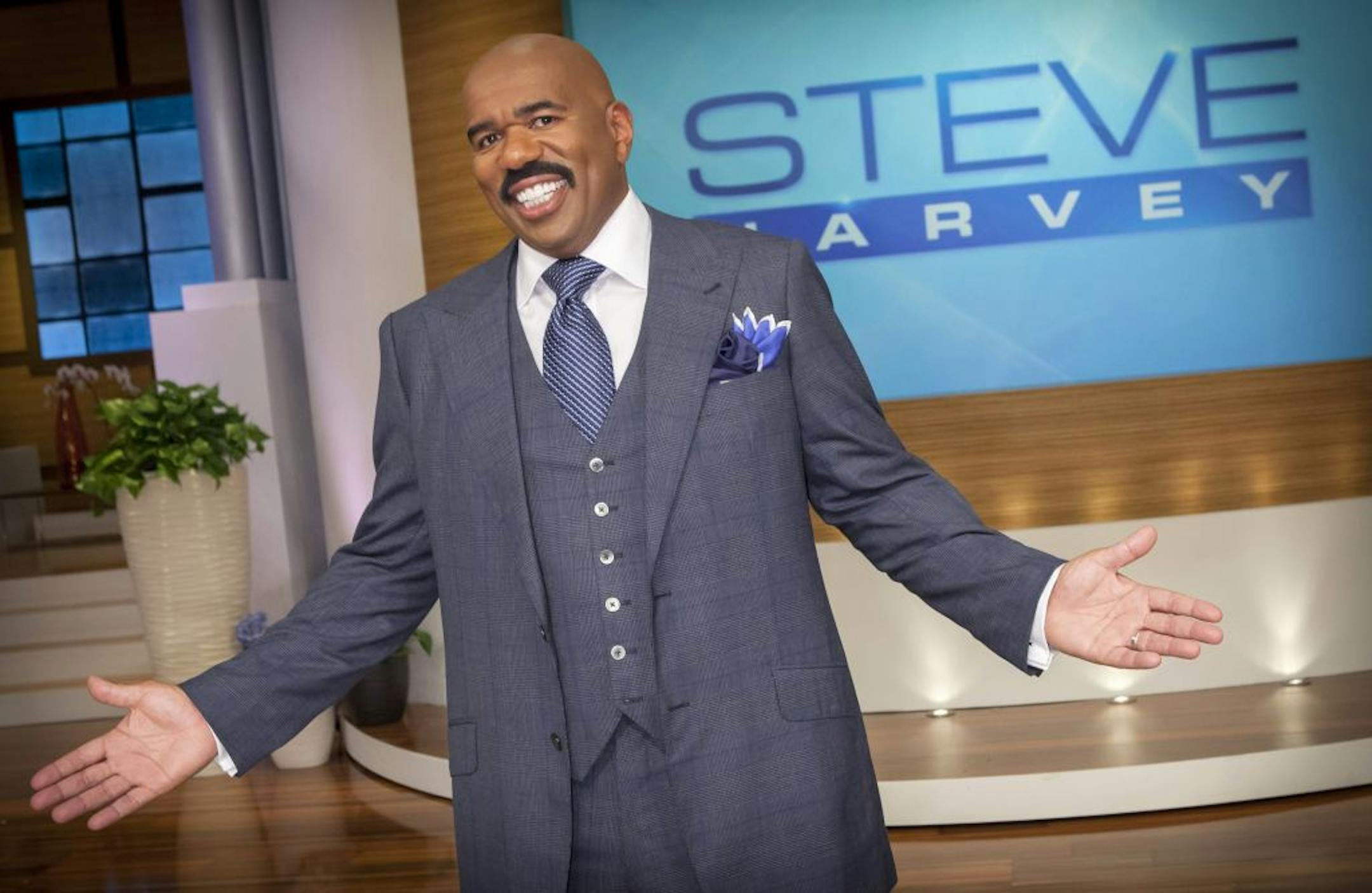 In this August 2012 photo provided by NBC, host Steve Harvey stands on the set of his new talk show "The Steve Harvey Show," in Chicago. The veteran comic, whose new show gets a jump on the fall season Tuesday, Sept. 4, 2012, was first approached about a show three years ago, when his first book, "Act Like a Lady, Think Like a Man," was on the best-seller lists.