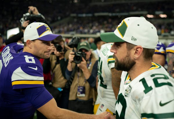 Minnesota Vikings quarterback Kirk Cousins (8) shook hands with Green Bay Packers quarterback Aaron Rodgers (12) after a game in 2018.