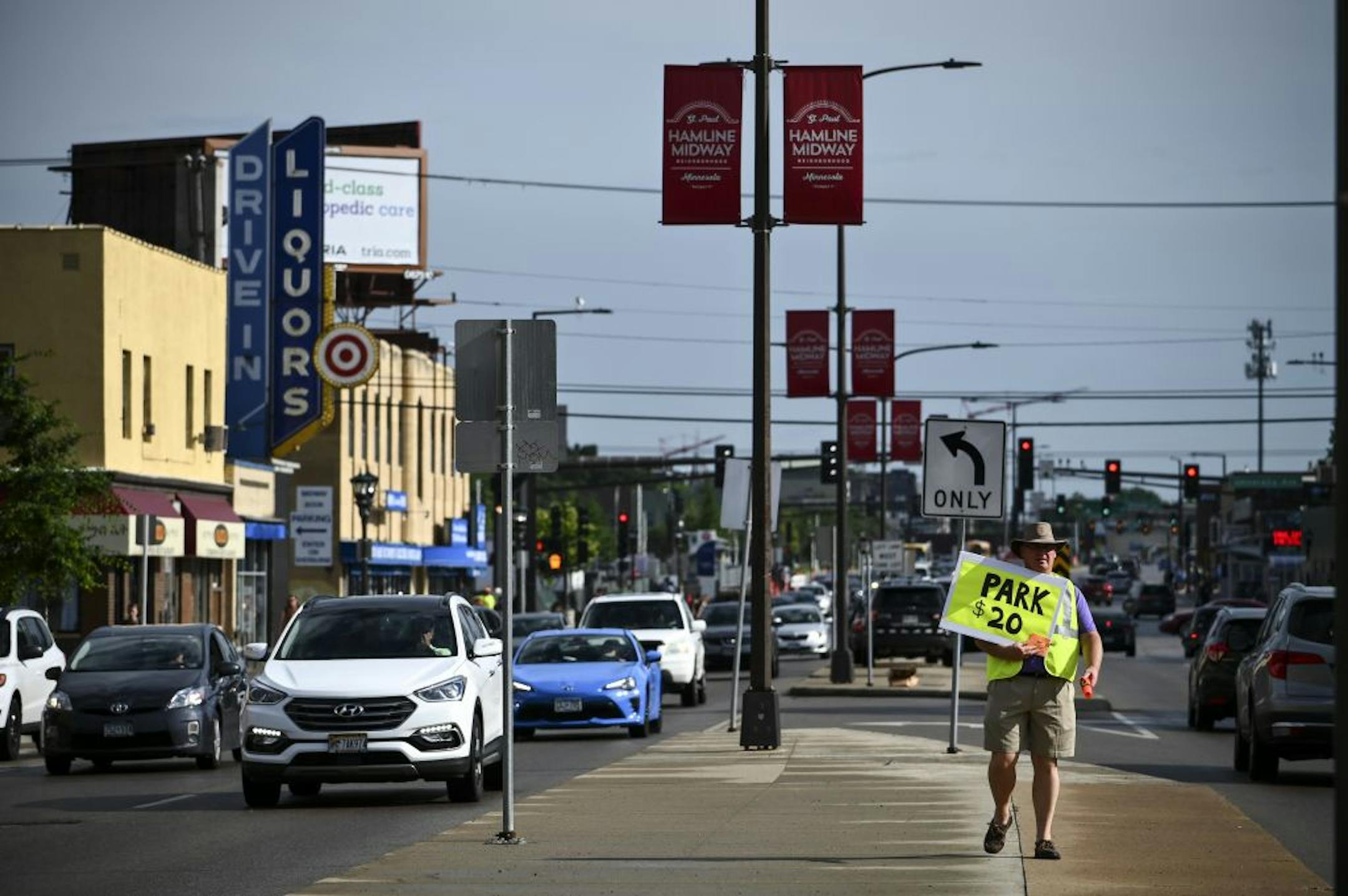 Rich Purcell, who co-owns the Holcomb-Henry-Boom-Purcell Funeral Home on Snelling Avenue, sold parking spots for $20 a game. He says he brings in about $500 a game, which he uses for his kids.