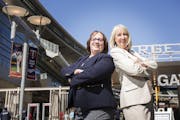 Sue Dubbs, right, and Mame O'Meara of Dubbs & O'Meara pose in front of Target Field on Wednesday, April 29, 2015. ] LEILA NAVIDI leila.navidi@startrib