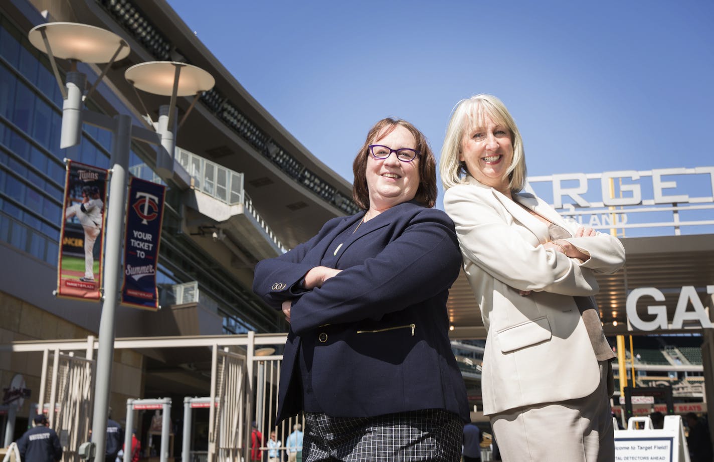 Sue Dubbs, right, and Mame O'Meara of Dubbs & O'Meara pose in front of Target Field on Wednesday, April 29, 2015. ] LEILA NAVIDI leila.navidi@startribune.com /