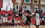 Chet Holmgren, shown here dunking against Totino-Grace in the Class 3A, section 4 championship on Friday, was named the Wootten National Player of the