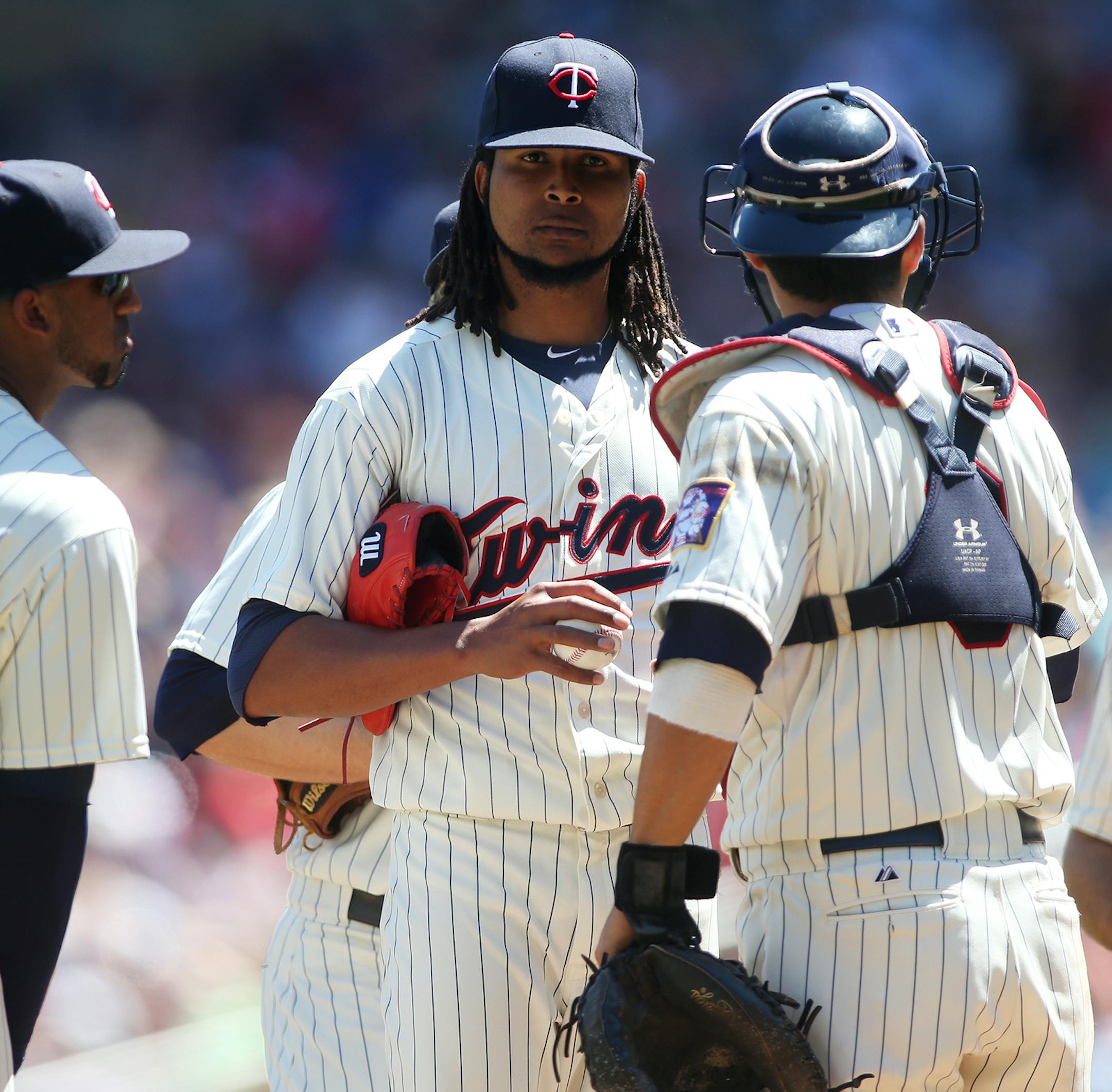 Minnesota Twins starting pitcher Ervin Santana (54) is spoken to on the mound against the Pittsburgh Pirates at Target Field in Minneapolis on Wednesday, July 29, 2015. ] LEILA NAVIDI leila.navidi@startribune.com /