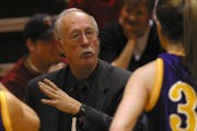 Rochester, MN 1/17/2004 Girls coach Myron Glass goes over the game plan courtside during a time-out against Kingsland