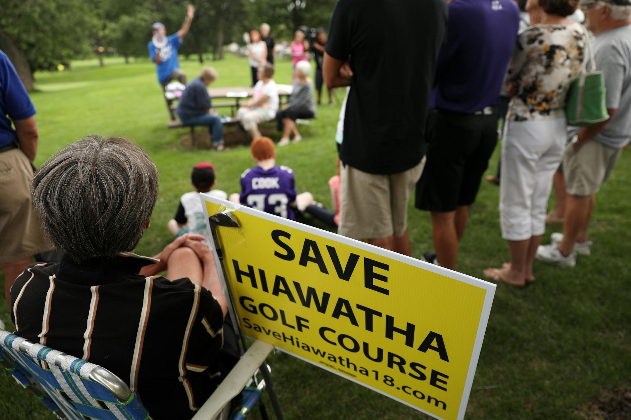 Golfers and supporters of the Hiawatha Golf Course held signs as they rallied against the Park Board's recent decision to reduce pumping and close the course at the end of 2019 season Tuesday.
