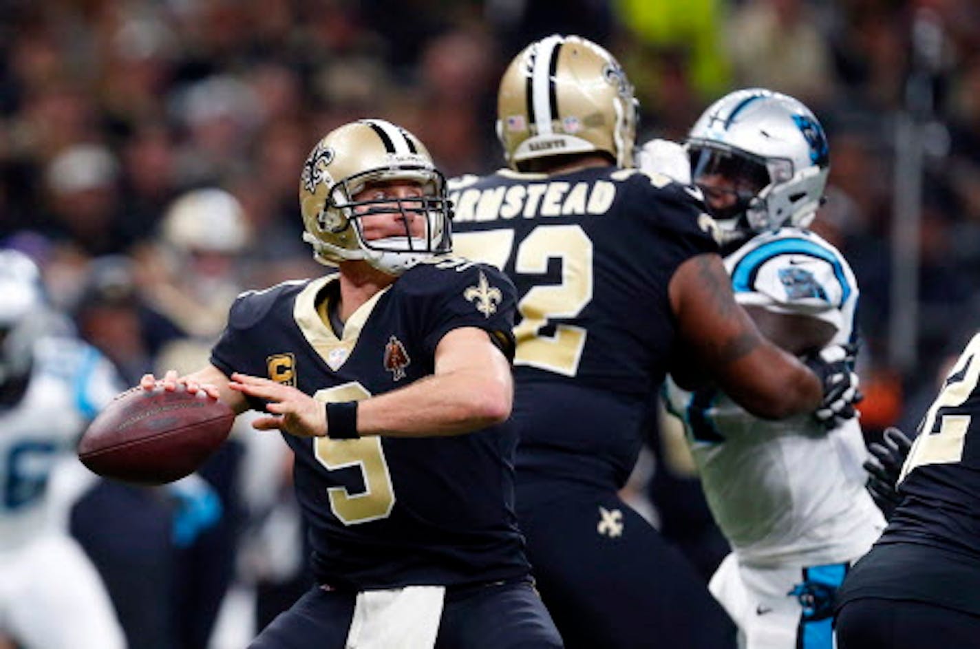 New Orleans Saints quarterback Drew Brees (9) passes in the first half of an NFL football game against the Carolina Panthers in New Orleans, Sunday, Jan. 7, 2018. (AP Photo/Butch Dill)