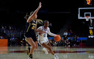 Taylor Woodson (21) defends against Kansas guard Wyvette Mayberry during the first round of the NCAA women's basketball tournament in March.