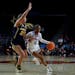Taylor Woodson (21) defends against Kansas guard Wyvette Mayberry during the first round of the NCAA women's basketball tournament in March.