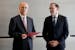 Prime Minister of the Palestinian Authority Mohammed Mustafa, left, speaks after receiving a document handed over by Norway's Foreign Minister Espen B