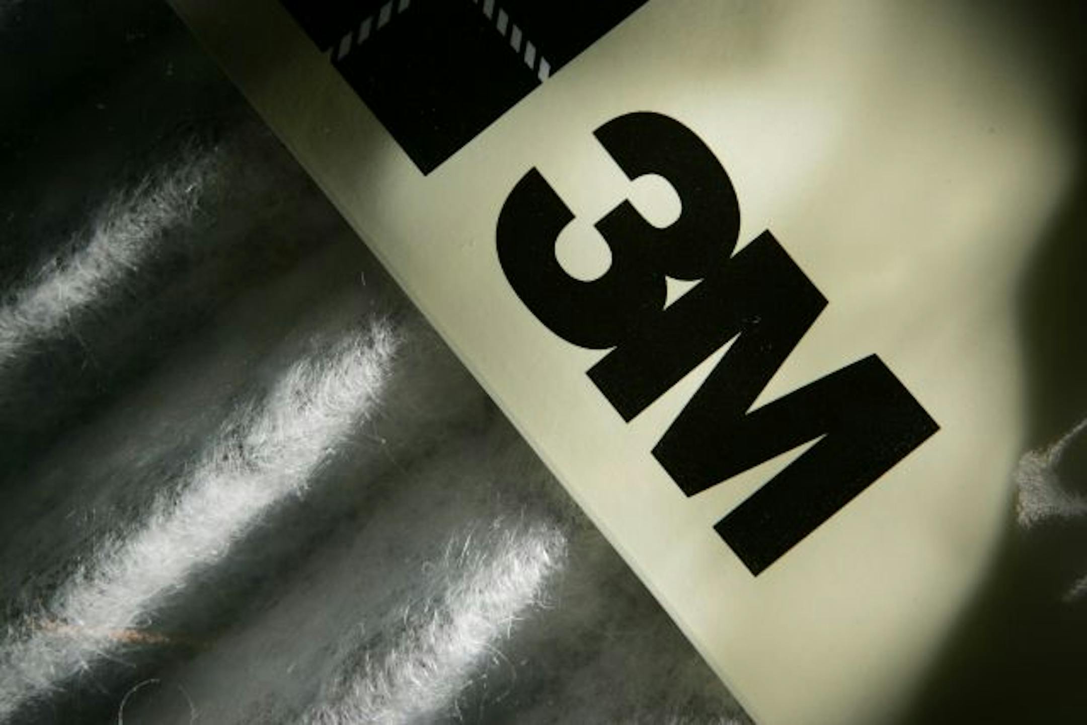 FILE - In this Jan. 23, 2006 file photo, the 3M logo is shown on a Filtrete air cleaning filter, in Des Moines, Iowa. 3M Co. disclosed Thursday, April 9, 2009, is offering early retirement packages to 3,600 employees, or 11 percent of its U.S. work force, to reduce costs even further amid the economic slowdown.