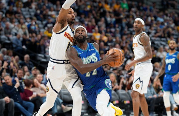 Timberwolves guard Patrick Beverley drives to the basket as Nuggets guard Monte Morris defends in the first half Friday.