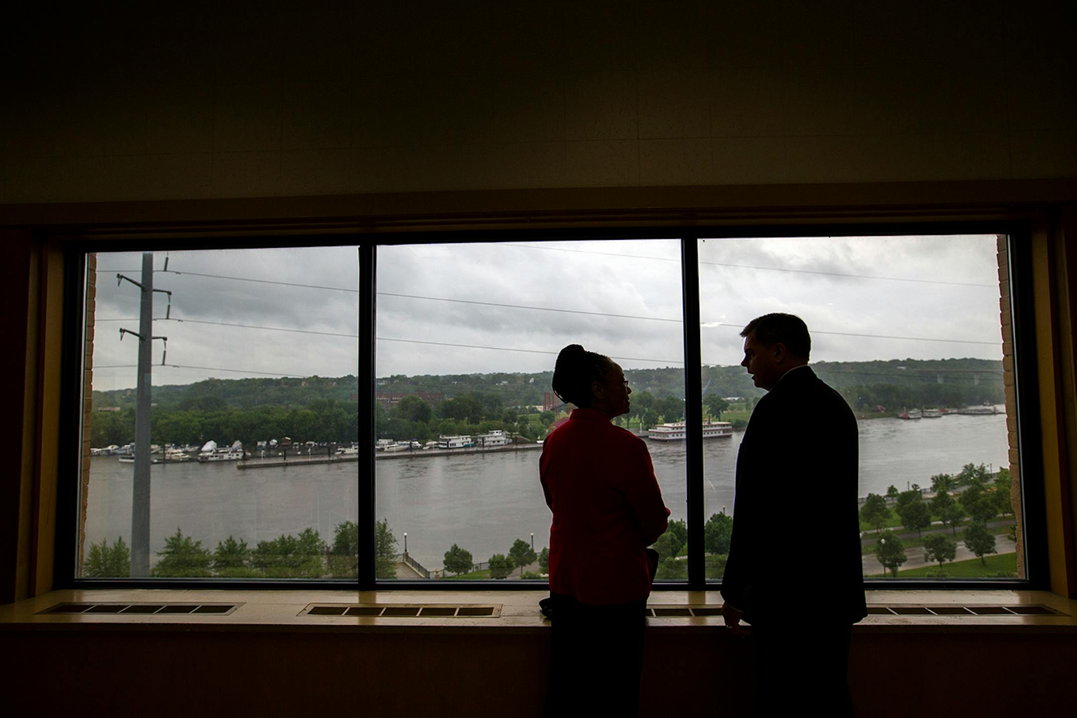 Ramsey County Commissioner Toni Carter, left, and David Spencer, vice president of judicial editorial at Thomson Reuters talk inside the former West Publishing building before a press conference in downtown St. Paul on Friday, May 29, 2015.