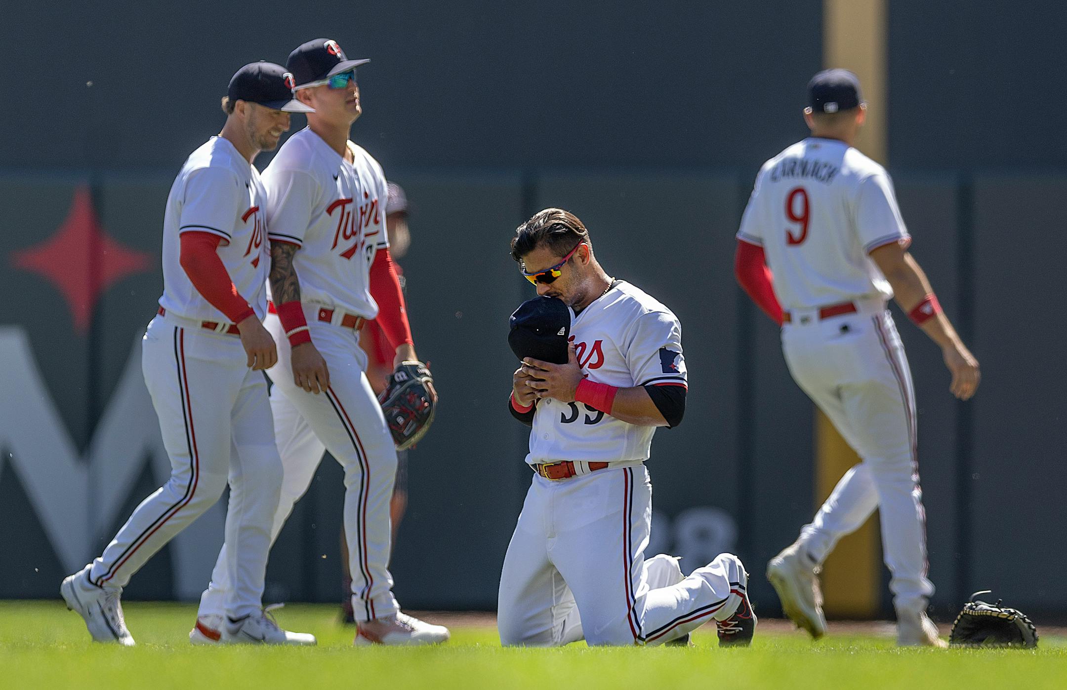 Minnesota Twins second baseman Donovan Solano (39) takes to his knees before the Twins faced the Chicago White Sox at Target Field Wednesday.