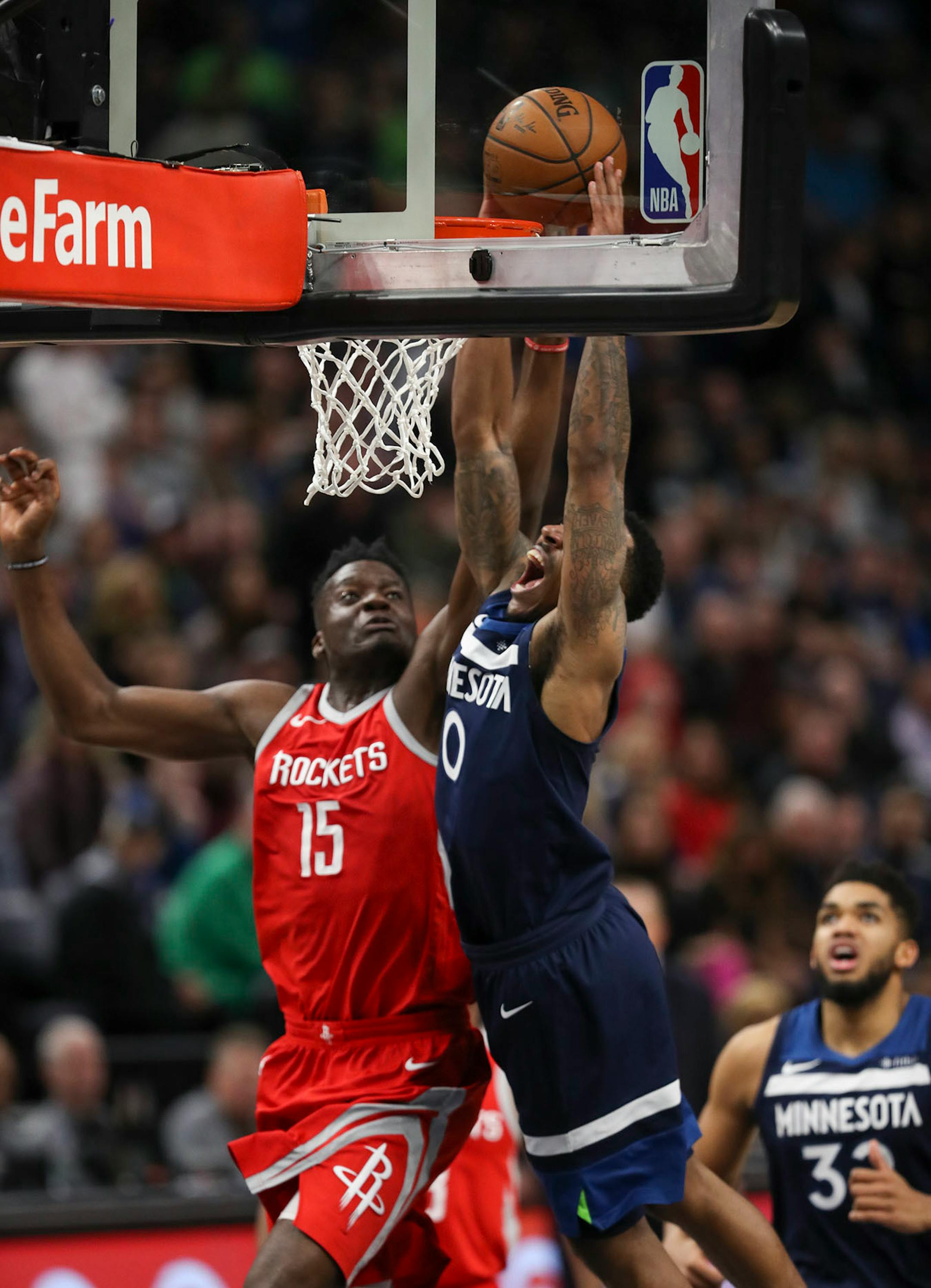 Minnesota Timberwolves guard Jeff Teague was fouled by Houston Rockets center Clint Capela as he tried to dunk in the fourth quarter. Teague led the Wolves with 23 points.