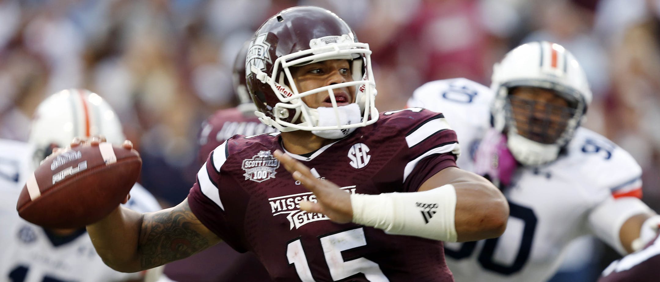 Mississippi State quarterback Dak Prescott (15) looks for an open man to pass to during the first half of an NCAA college football game against Auburn in Starkville, Miss., Saturday, Oct 11, 2014. No. 3 Mississippi State beat No. 2 Auburn, 38-23 (AP Photo/Rogelio V. Solis)
