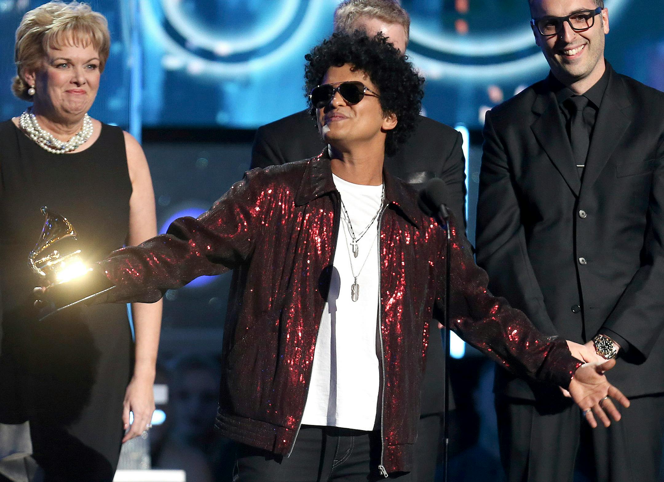 Bruno Mars accepts the award for record of the year for "24K Magic" at the 60th annual Grammy Awards at Madison Square Garden on Sunday, Jan. 28, 2018, in New York.