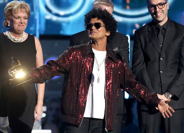 Bruno Mars accepts the award for record of the year for "24K Magic" at the 60th annual Grammy Awards at Madison Square Garden on Sunday, Jan. 28, 2018