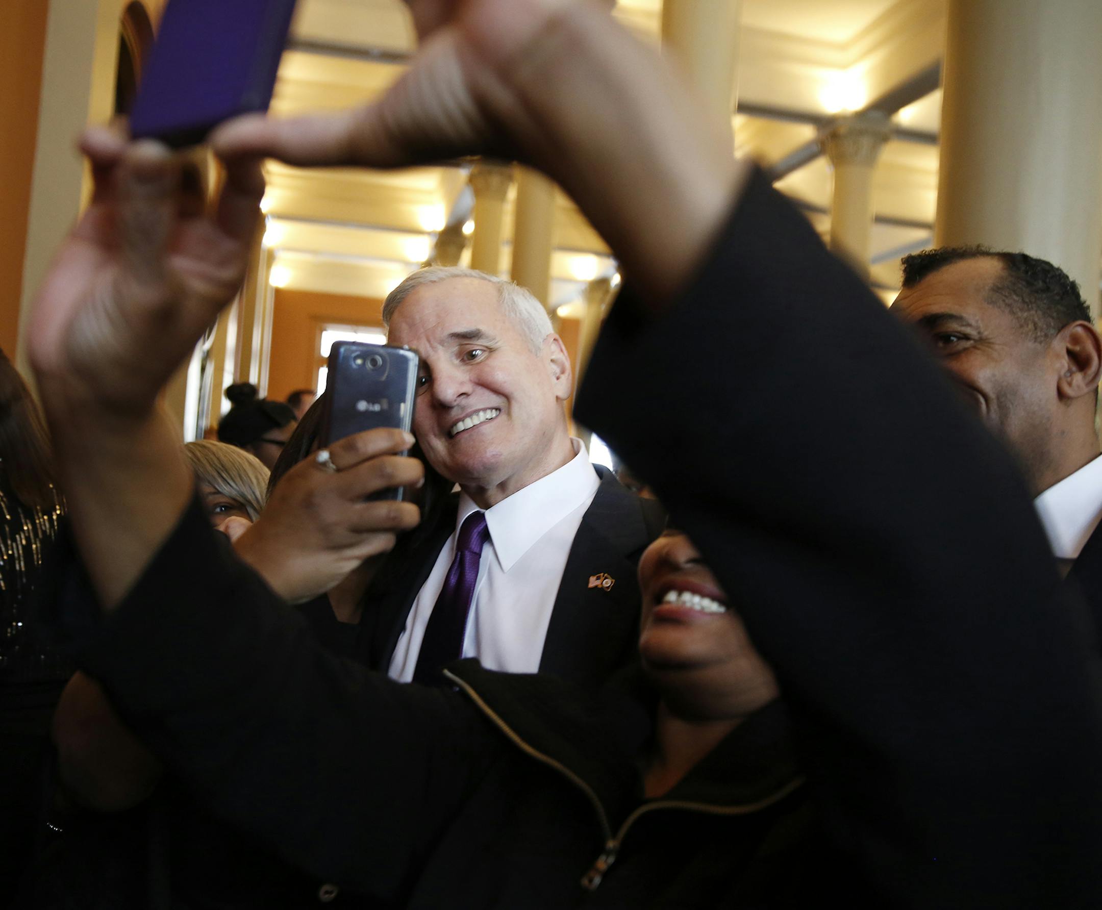 Gov. Mark Dayton poses for photos with the Greater Mount Vernon Baptist Church Choir after the Inauguration Ceremony at Landmark Center in St. Paul on Monday, January 5, 2015. ] LEILA NAVIDI leila.navidi@startribune.com /