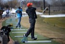 John Santiago of Maplewood spent sometime hitting golf balls off the matts at The Ponds at Battle Ceek in Maplewood.