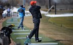 John Santiago of Maplewood spent sometime hitting golf balls off the matts at The Ponds at Battle Ceek in Maplewood.