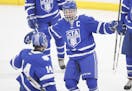 Payton Matsui(14) and Ray Christy(15) celebrate a goal. ]St. Thomas Academy will be playing Benilde-St. Margaret's at the St. Louis Park Recreation Ce
