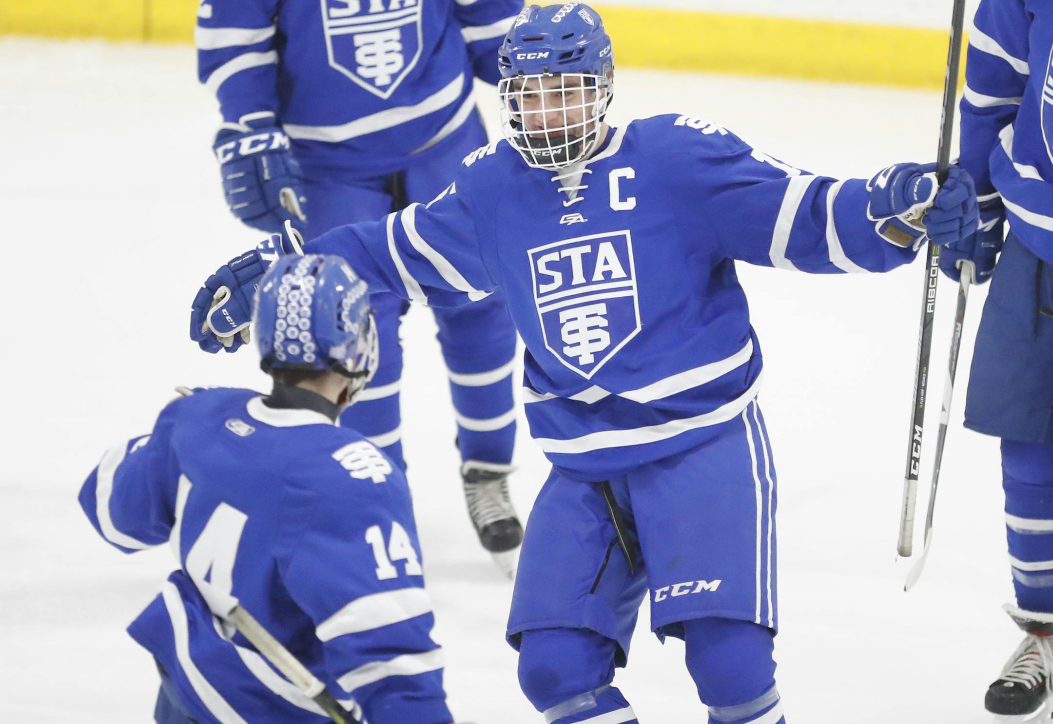 Payton Matsui(14) and Ray Christy(15) celebrate a goal. ]St. Thomas Academy will be playing Benilde-St. Margaret's at the St. Louis Park Recreation Center Richard Tsong-Taatariiïrtsong-taatarii@startribune.com