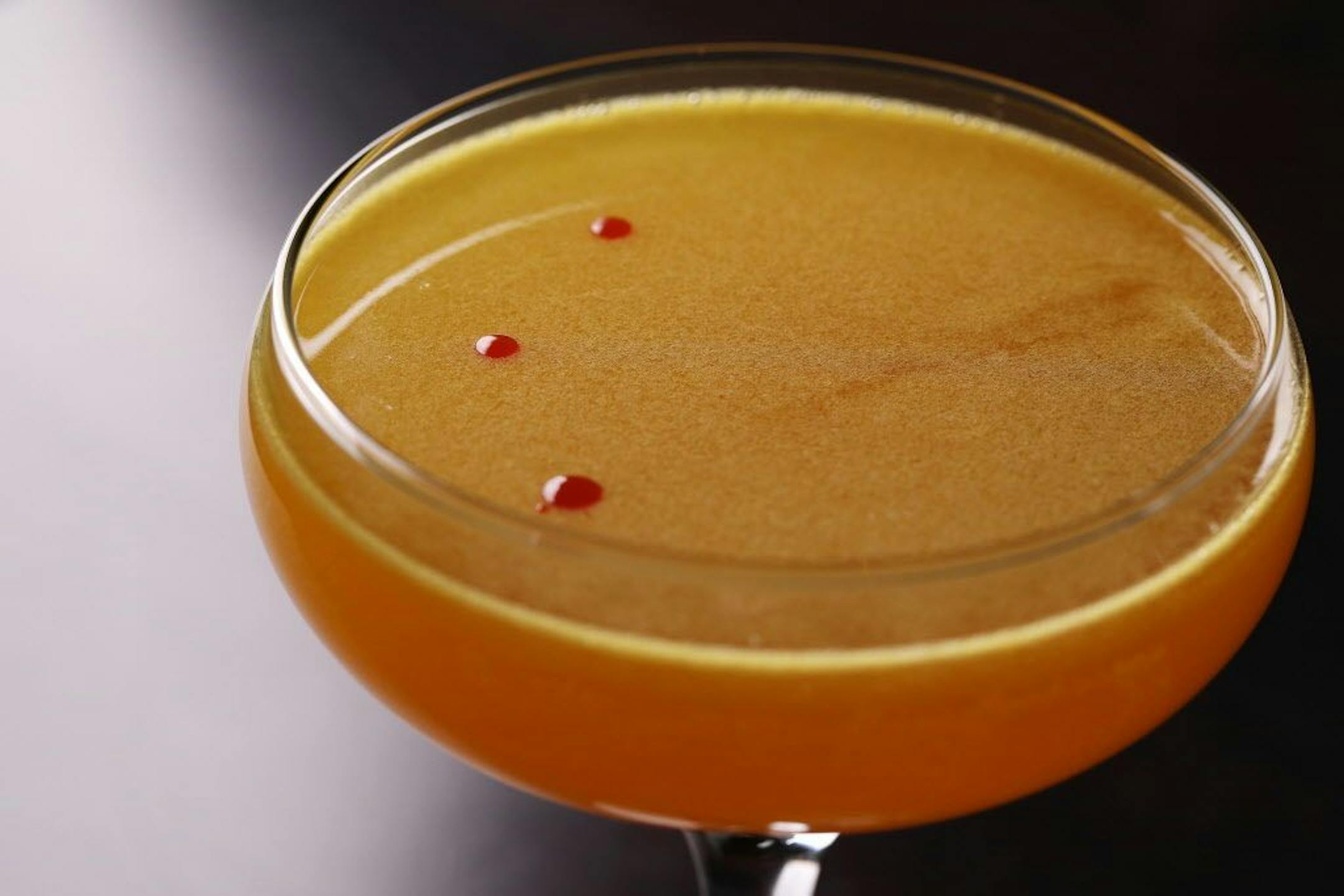 Pictured is the Madagascar, a bees knees with turmeric gin, honey and lemon.