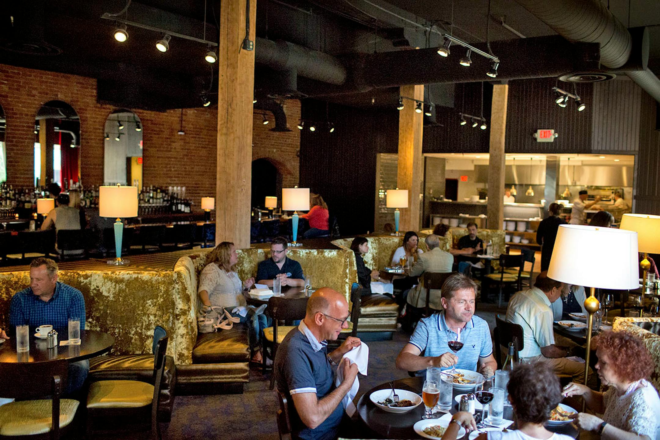 People sit for dinner in large velvet booths at Lovechild in La Crosse. ] COURTNEY PEDROZA • courtney.pedroza@startribune.com June 22-24, 2017; Wisconsin restaurants, cafes, bars, bakeries and breweries; Dining along the Mississippi River.