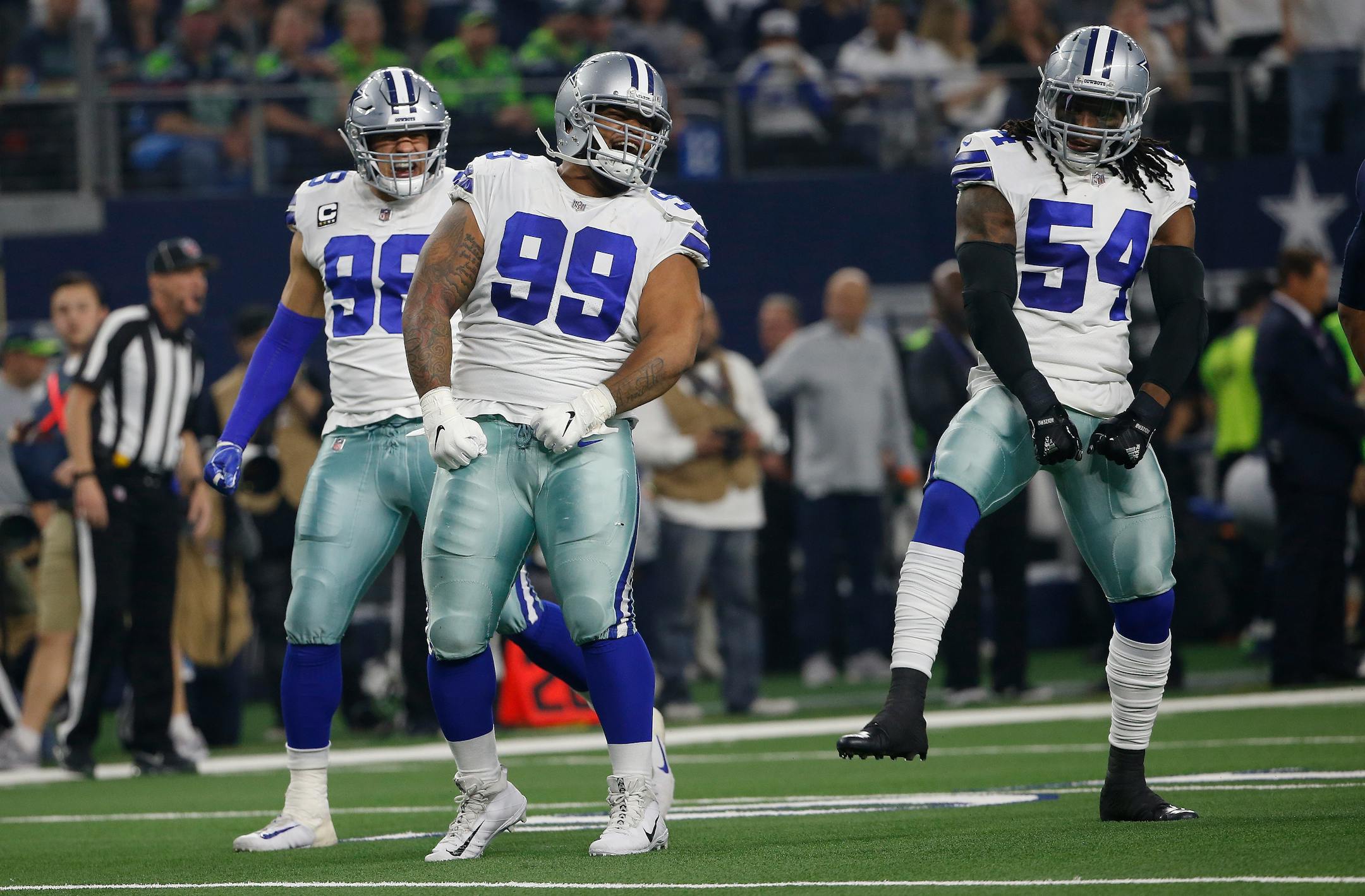 Dallas Cowboys defensive tackle Antwaun Woods (99) celebrates the defense's stoping of the Seattle Seahawks during the first half of the NFC wild-card NFL football game in Arlington, Texas, Saturday, Jan. 5, 2019. (AP Photo/Ron Jenkins)