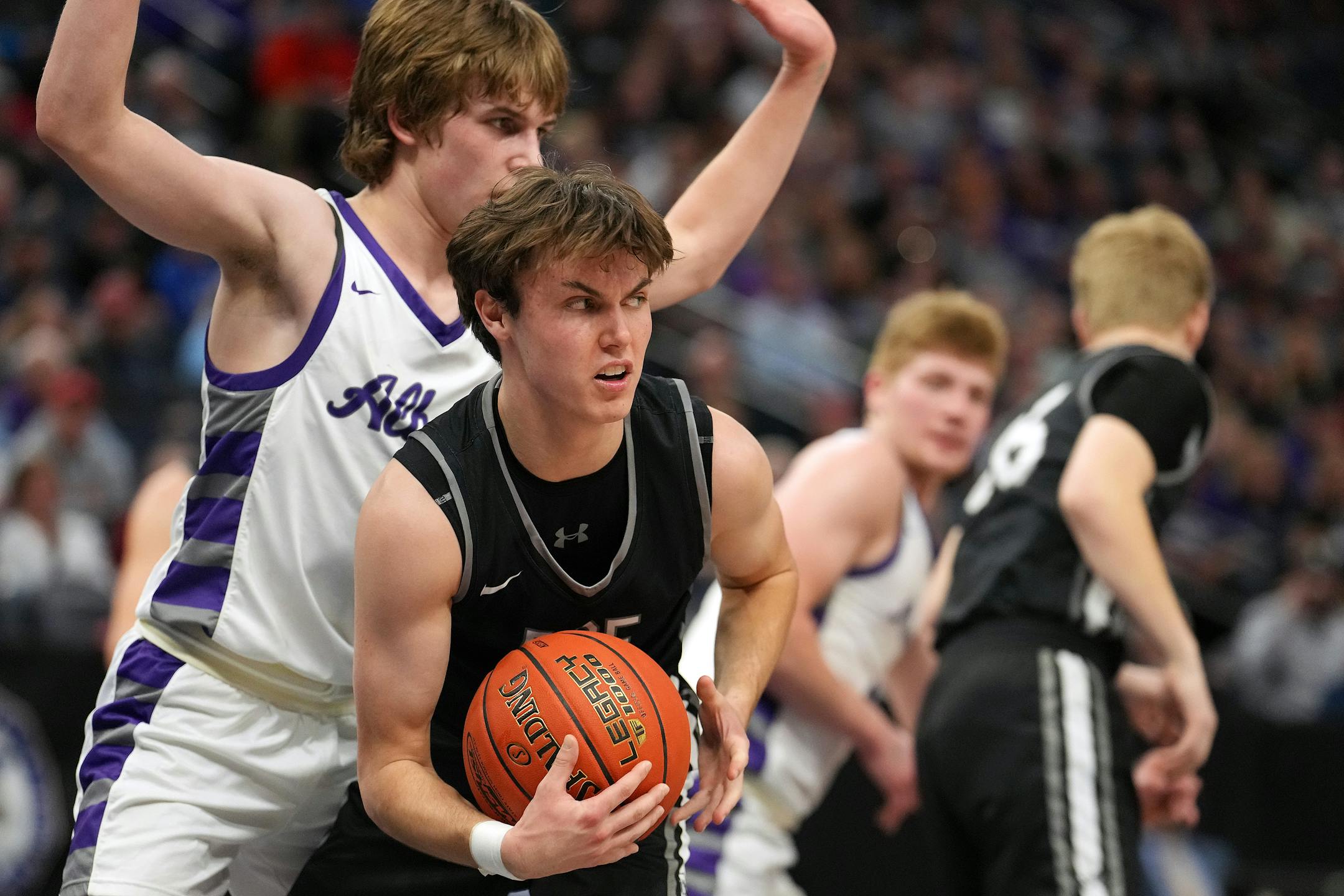 DGF guard Drew Sheeley (3) grabs a rebound in the first half.