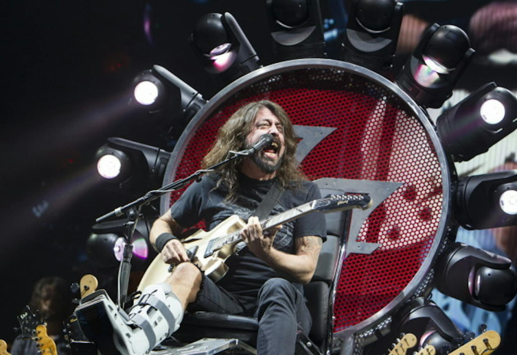 A hobbled but far from mellowed Dave Grohl with the Foo Fighters in 2015 at Xcel Energy Center. / Star Tribune file