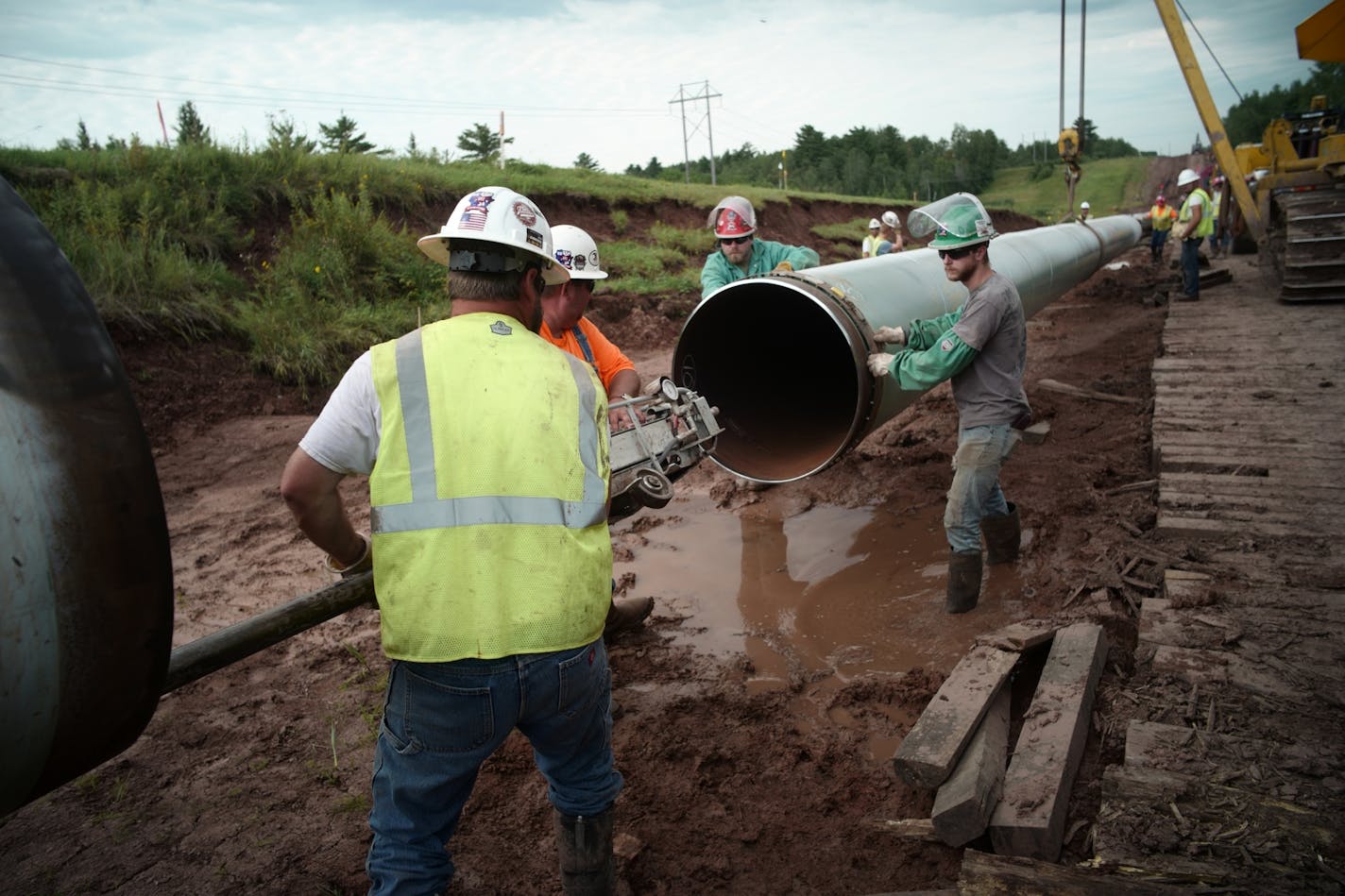 Workers make sure that each section of Line 3 that is joined passes mustard beginning with an inside weld from an automated machine.