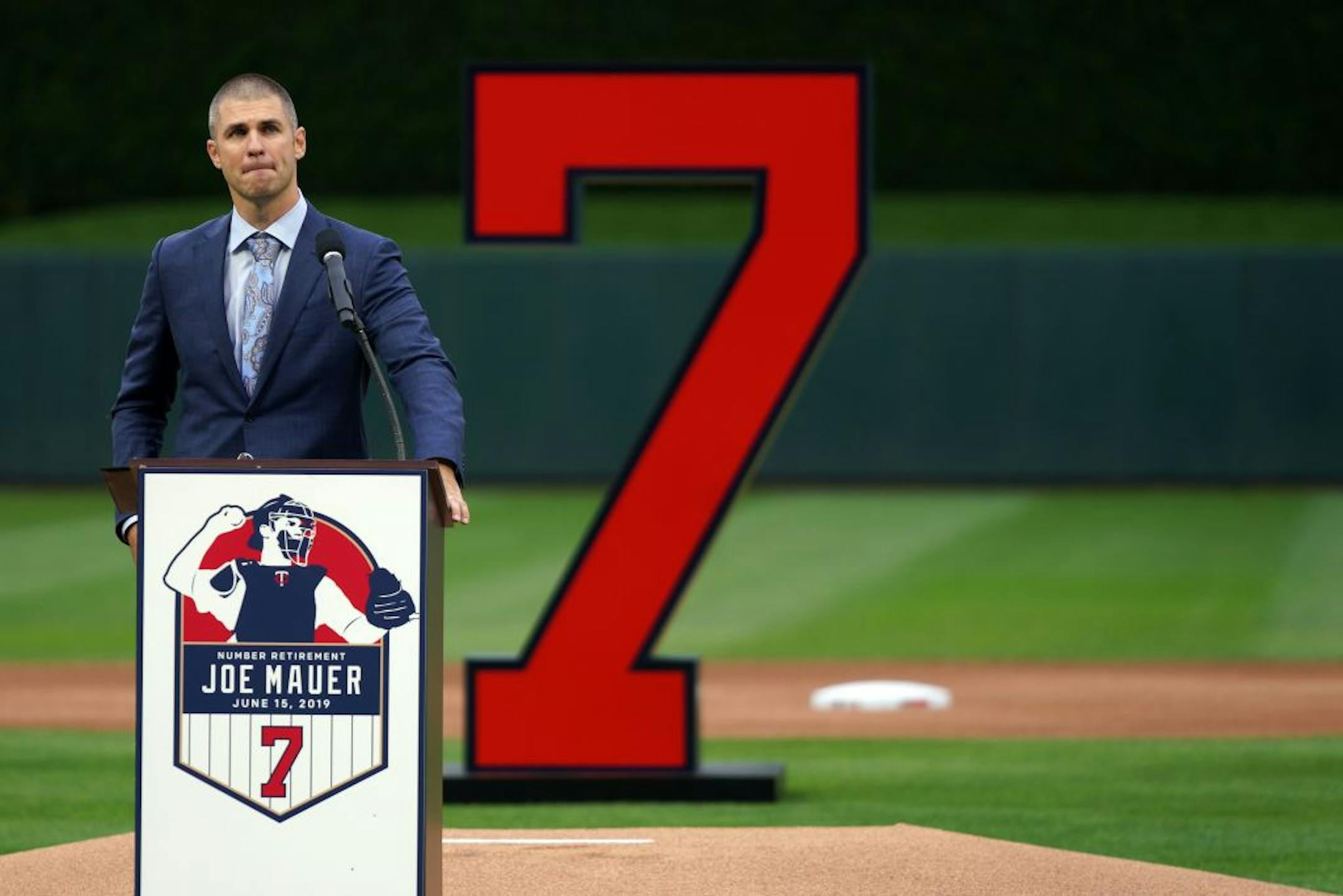 Former Minnesota Twins star Joe Mauer fought back tears as he spoke during a pregame ceremony to retire his number 7 Saturday.