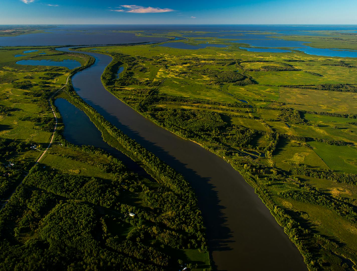 The Red River of the North empties into the Netley-Libau Marsh at the southern end of Lake Winnipeg in late August. ] (AARON LAVINSKY/STAR TRIBUNE) aaron.lavinsky@startribune.com RIVERS PROJECT: We look at three of Minnesota's rivers, including the Mississippi, Red and Chippewa, to see how land use effects water quality and pollution.