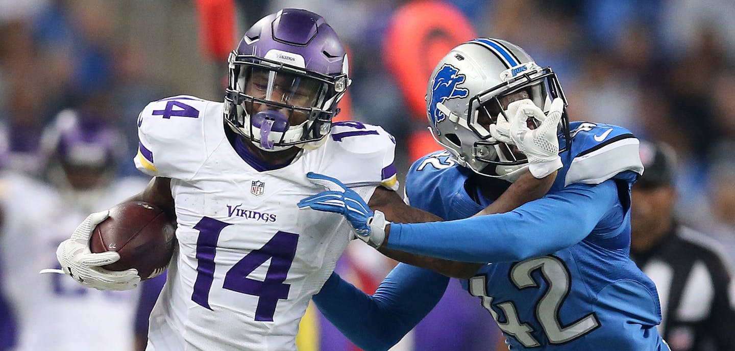 Minnesota Vikings wide receiver Stefon Diggs (14) stiff armed Detroit Lions strong safety Isa Abdul-Quddus (42) as he picked up a first down in the second quarter at Ford Field Sunday October 25, 2015 in Detroit, MI. ] The Detroit Lions hosted the Minnesota Vikings Sunday at Ford Field. Jerry Holt/ Jerry.Holt@Startribune.com