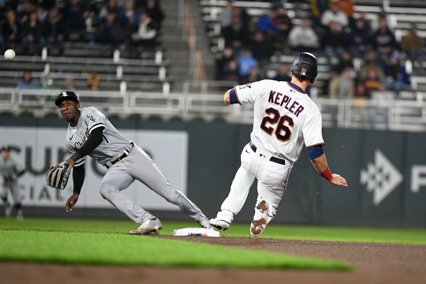 White Sox shortstop Tim Anderson reaches for a wide throw as the Twins' Max Kepler slides safely to second