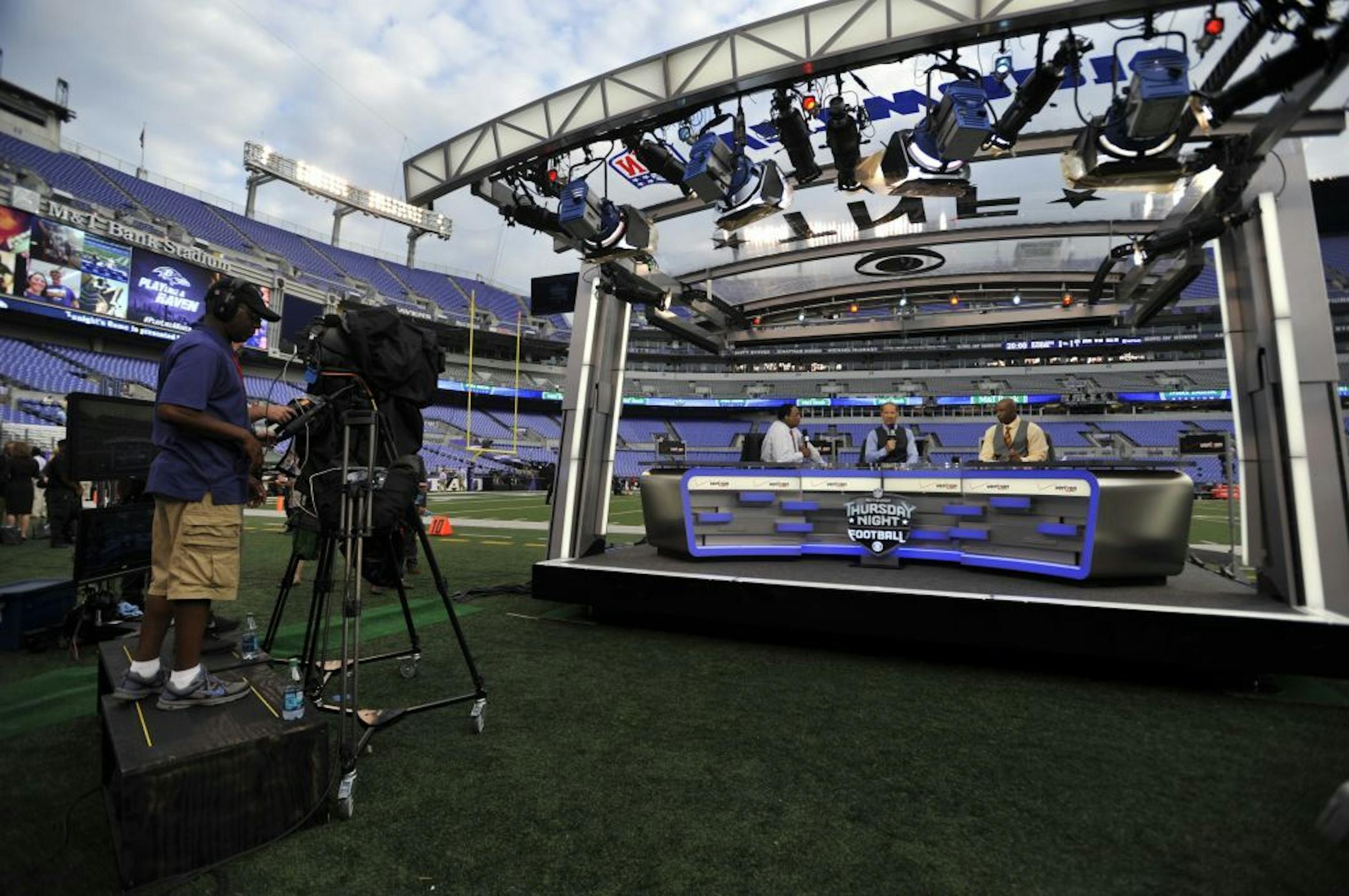 CBS' Thursday Night Football set is on the field before an NFL football game between the Baltimore Ravens and the Pittsburgh Steelers Thursday, Sept. 11, 2014, in Baltimore.