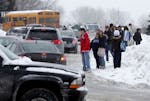 Blaine High School students waited for their rides after school was canceled Thursday.