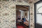 Amy Kehoe and Todd Nickey of the Los Angeles-based design firm Nickey Kehoe discuss wallpaper options at Nickey’s home in Pasadena, Calif.