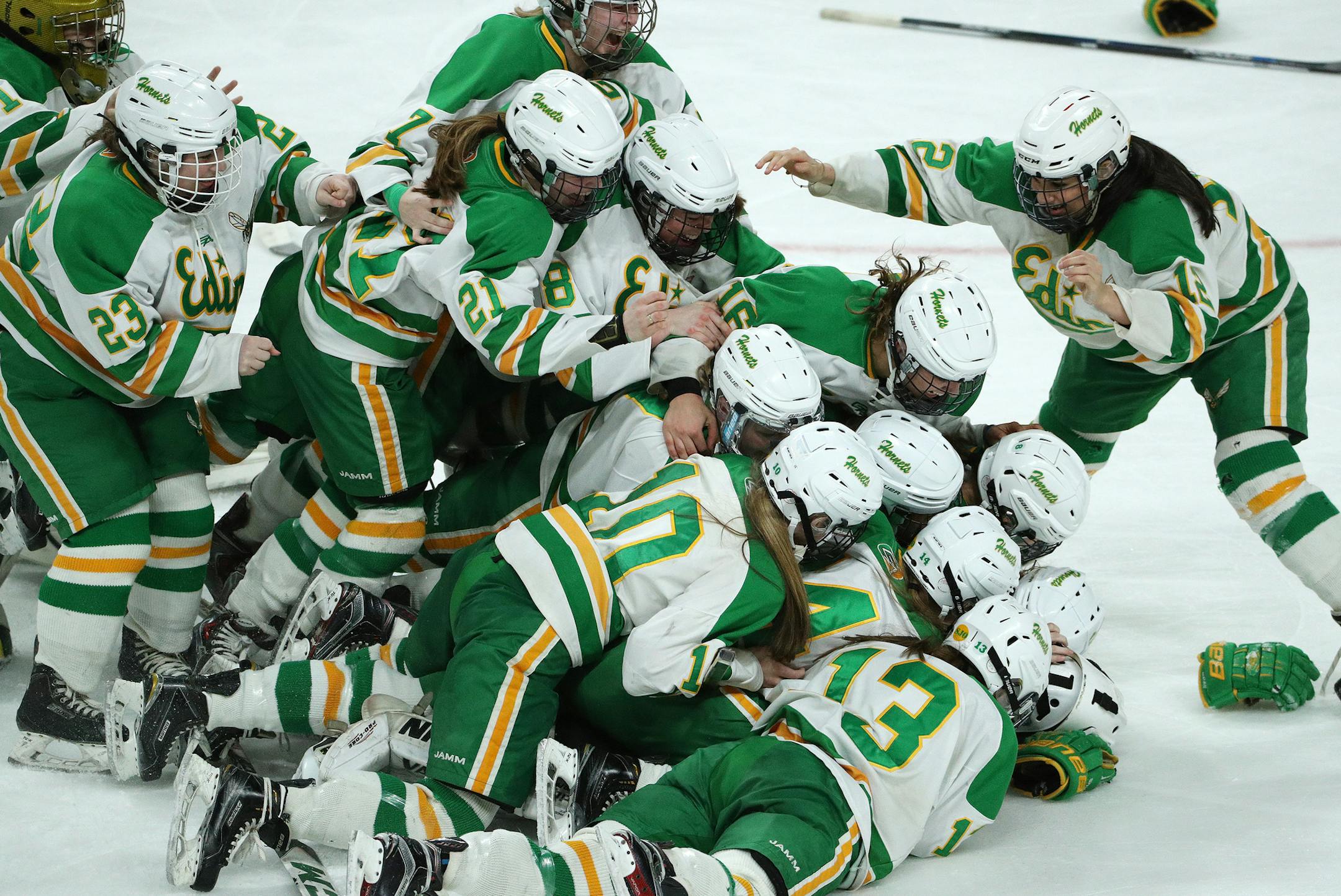 Edina goalkeeper Anna Goldstein (35) is mobbed by her teammates after the win. ] ANTHONY SOUFFLE • anthony.souffle@startribune.com Players competed in the Class 2A girls' hockey state championship Saturday, Feb. 25, 2017 at the Xcel Energy Center in St. Paul, Minn.